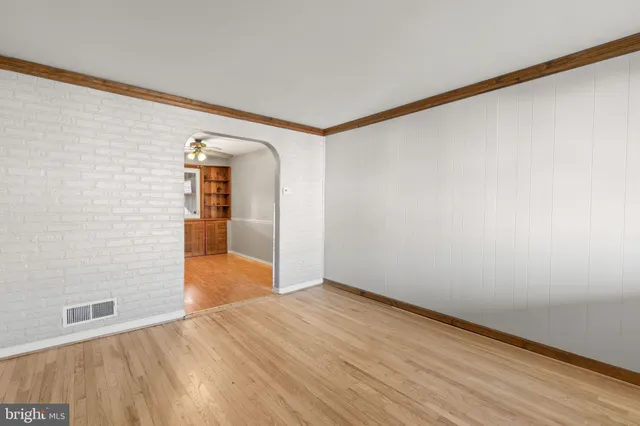 a view of hallway with wooden floor