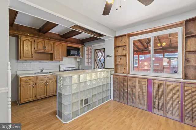 a kitchen with stainless steel appliances granite countertop a stove and cabinets