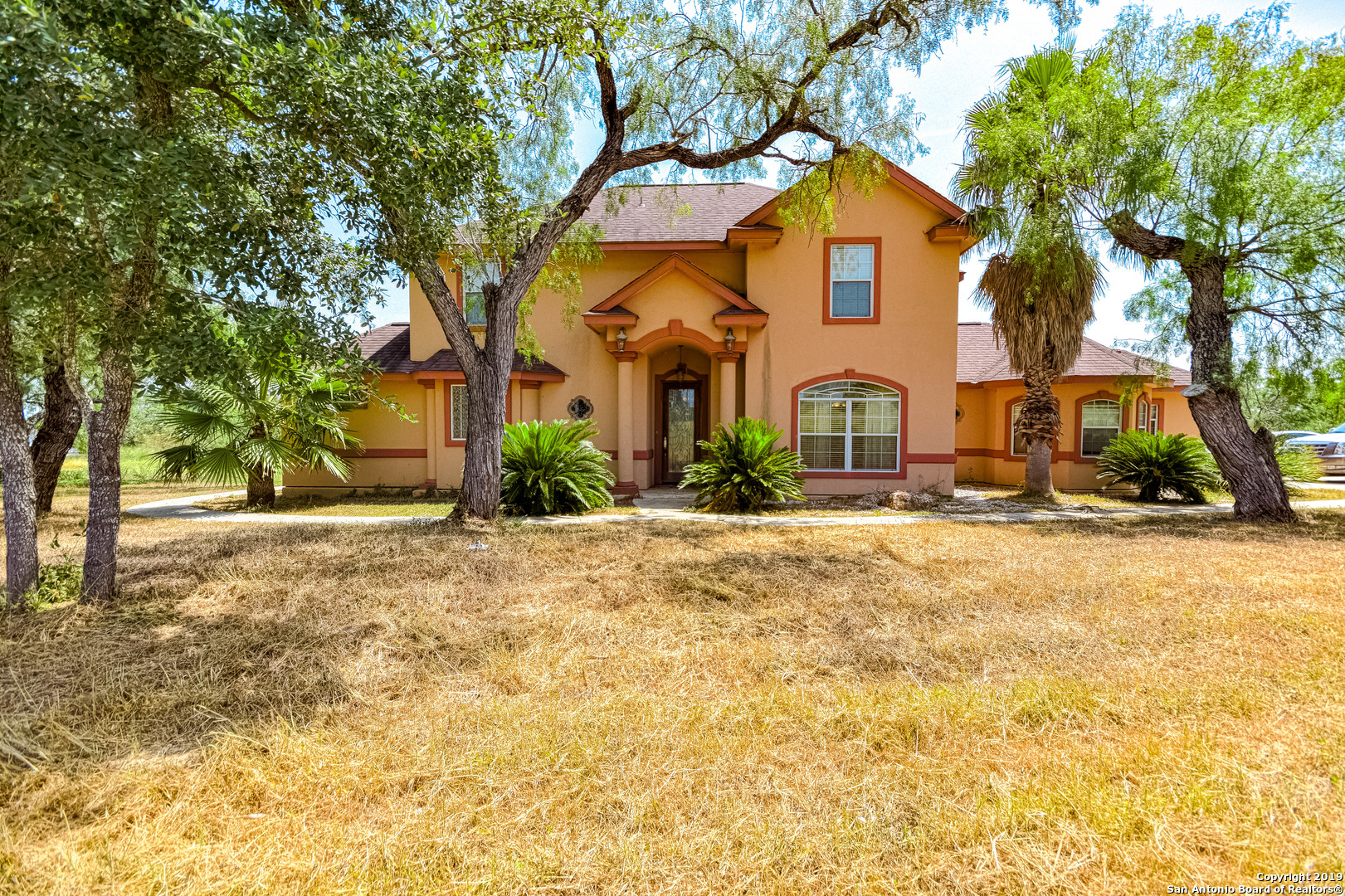 21410 Senior Road Von Ormy, TX 78073 - Photo 1 of 1 a front view of a house with a yard