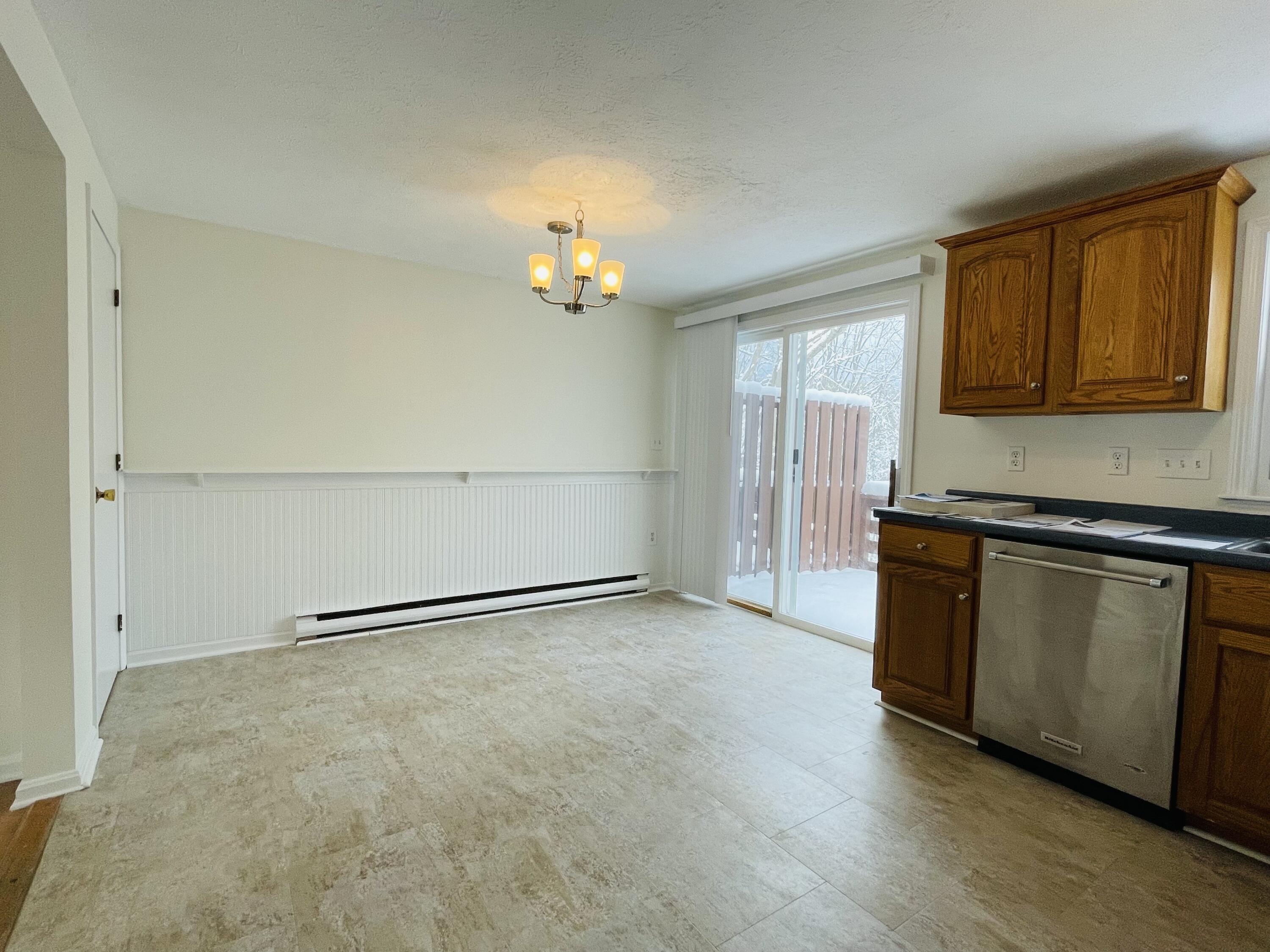 39 Powder Mill Drive, Unit 39 Kennebunk, ME 04043 - Photo 9 of 21 Eat in kitchen with deck access!