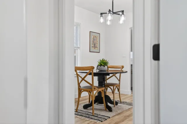 a dining room with furniture and window