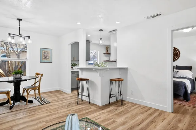 a view of kitchen with cabinets and wooden floor