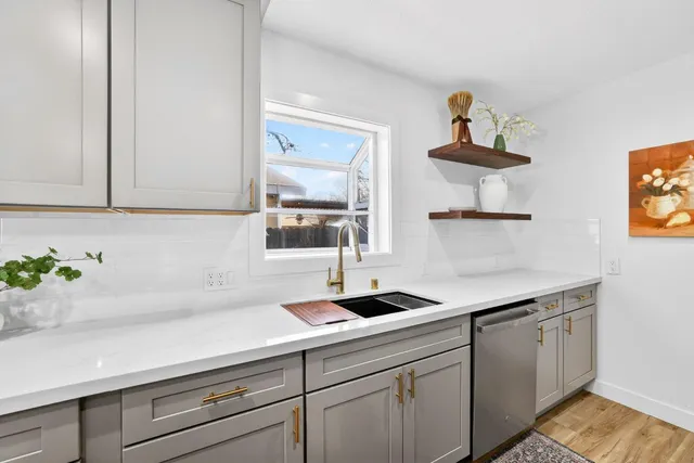 a kitchen with a sink and cabinets