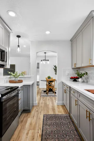 a kitchen with a sink and wooden cabinets