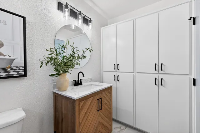 a bathroom with a sink and a mirror