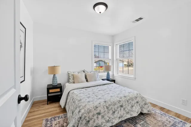 a bedroom with a bed and a window