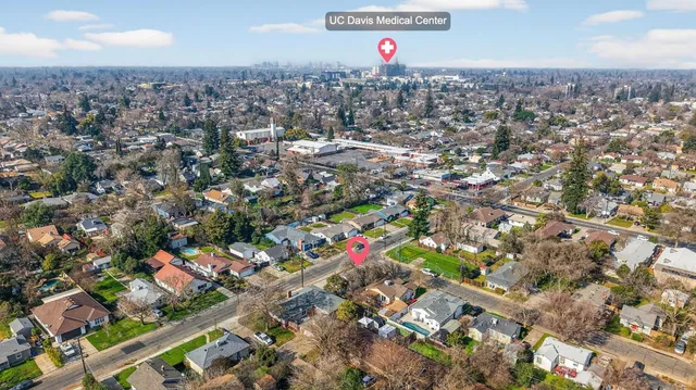 an aerial view of residential houses with outdoor space