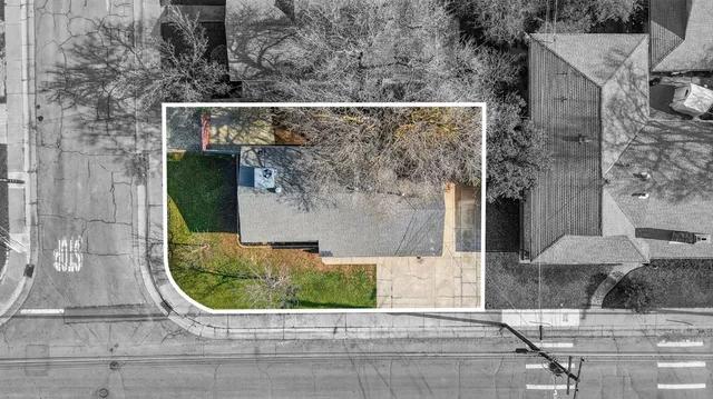 an aerial view of a house with a backyard space