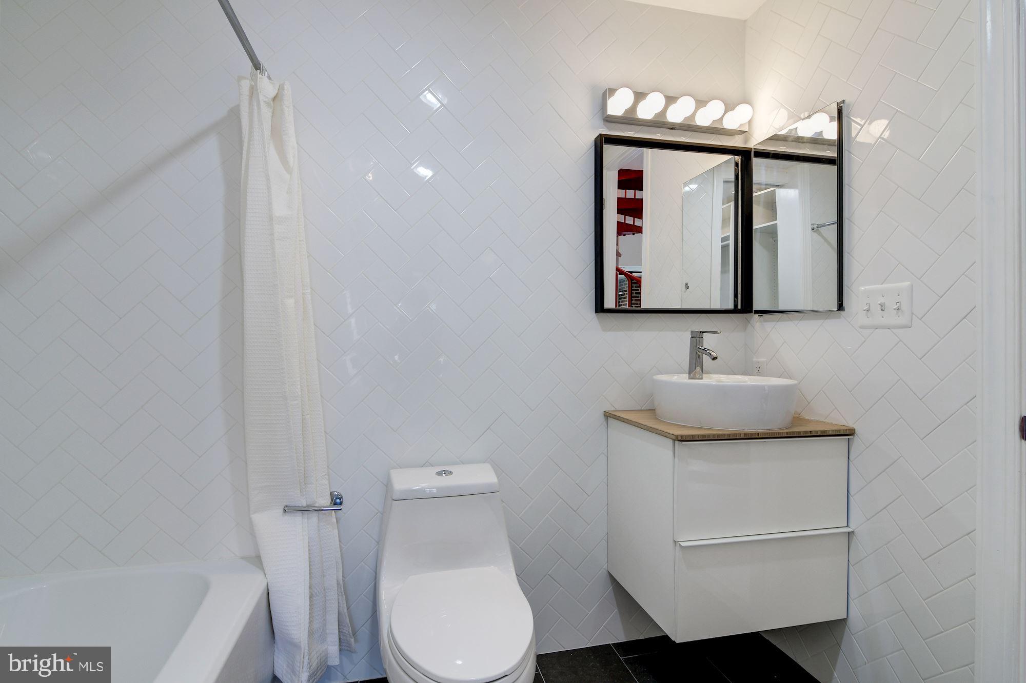 3225 Grace Street Northwest, Unit 208 Washington, DC 20007 - Photo 8 of 16 Master bathroom with tub/shower