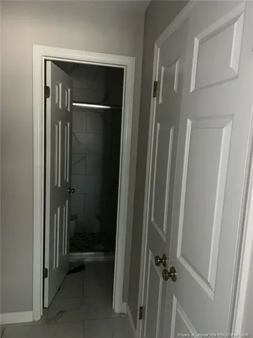 a bathroom with a glass door shower