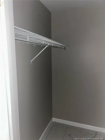 a view of a room with racks on the wall