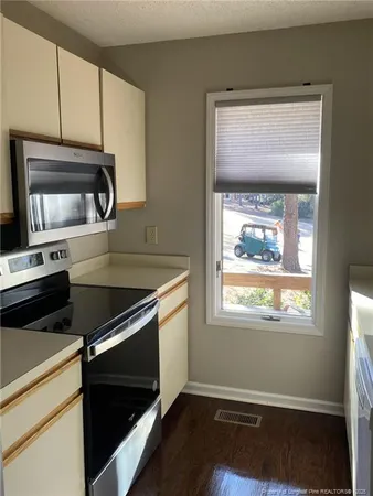 a kitchen that has a microwave and a sink in it