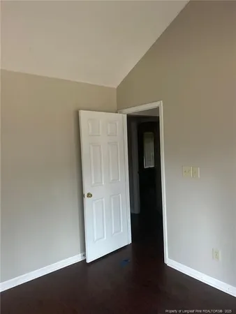 an empty room with wooden floor