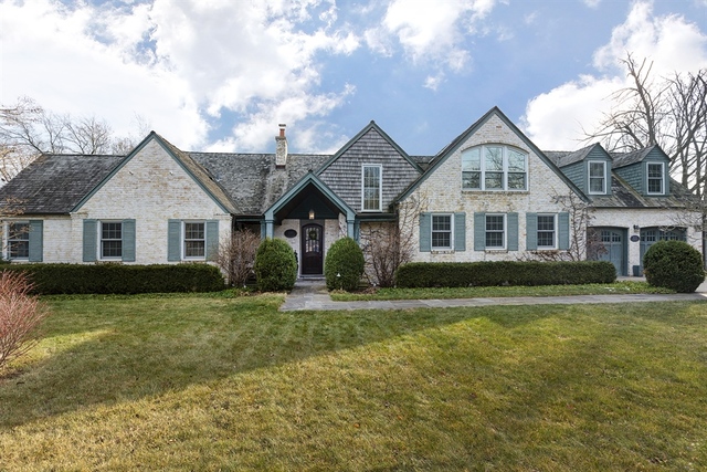 835 Shermer Road Northbrook, IL 60062 - Photo 1 of 39 a front view of a house with a garden