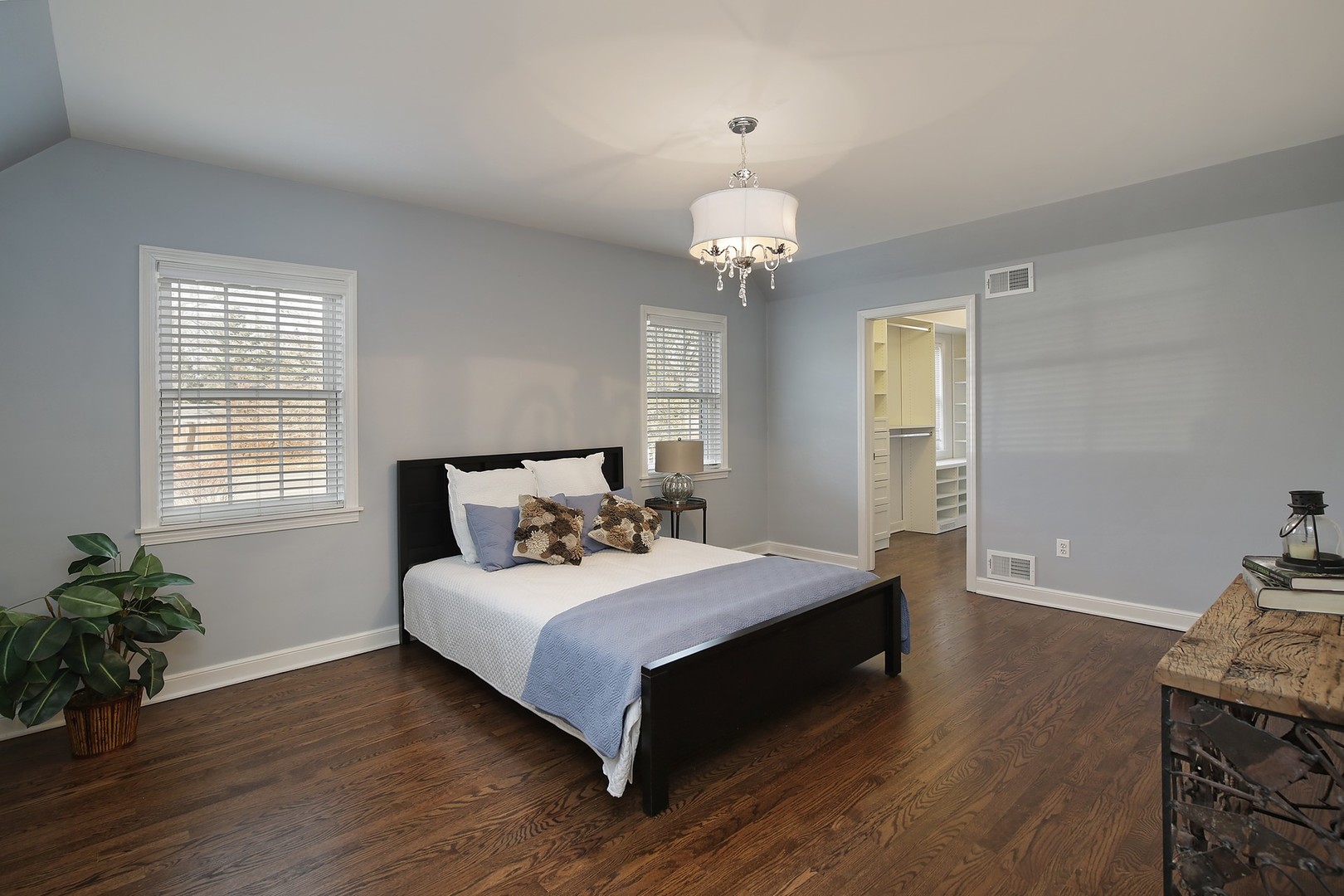 835 Shermer Road Northbrook, IL 60062 - Photo 14 of 39 a spacious bedroom with a bed and wooden floor