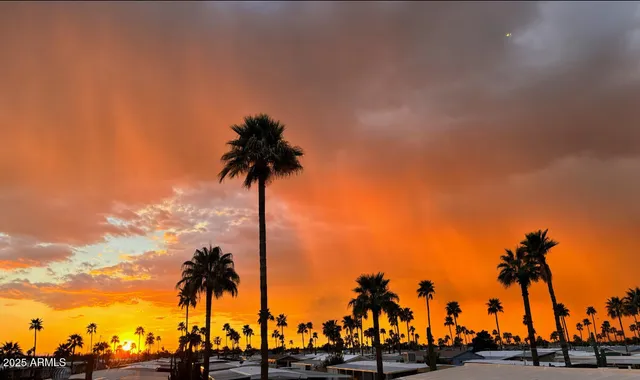 a view of a patio with a table and chairs