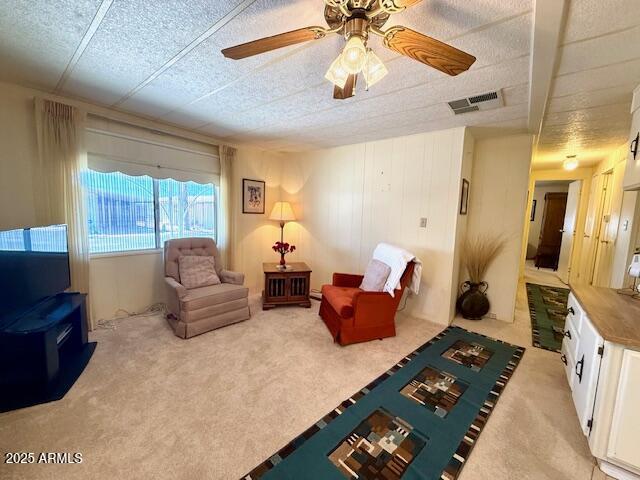 2605 South Tomahawk Road, Unit 46 Apache Junction, AZ 85119 - Photo 11 of 47 a living room with furniture and a flat screen tv