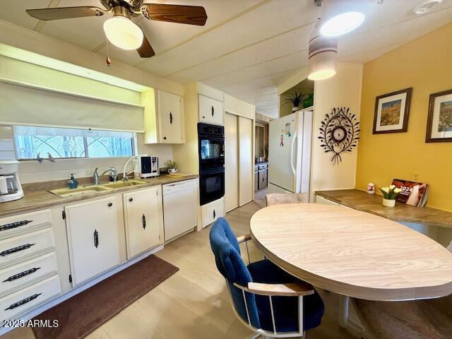2605 South Tomahawk Road, Unit 46 Apache Junction, AZ 85119 - Photo 15 of 47 a kitchen with stainless steel appliances granite countertop a sink a stove and a refrigerator