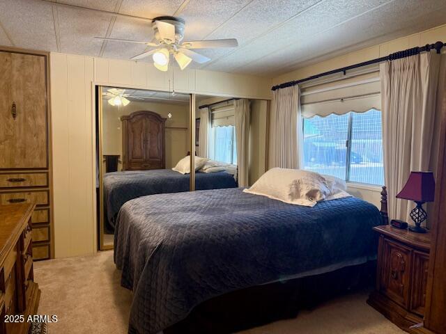 2605 South Tomahawk Road, Unit 46 Apache Junction, AZ 85119 - Photo 26 of 47 a bedroom with a bed and a chandelier