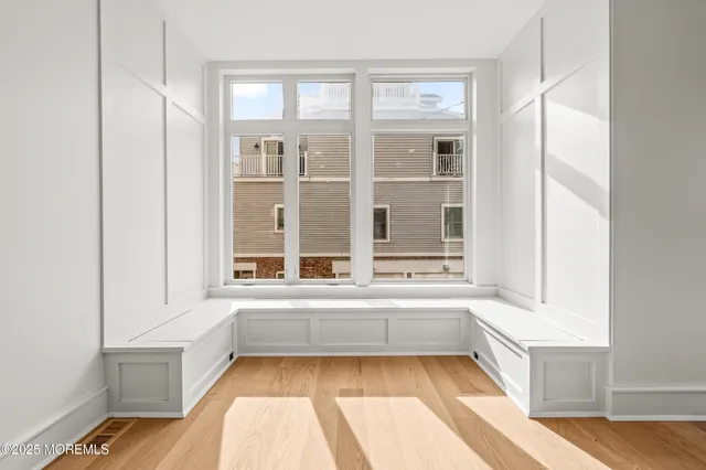 a view of a bathtub in a room with a window