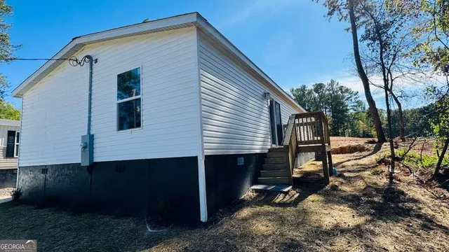 a view of a back yard of the house