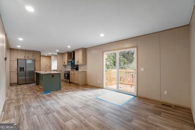 a view of kitchen with wooden floor