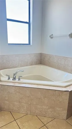 a white toilet sitting next to a shower