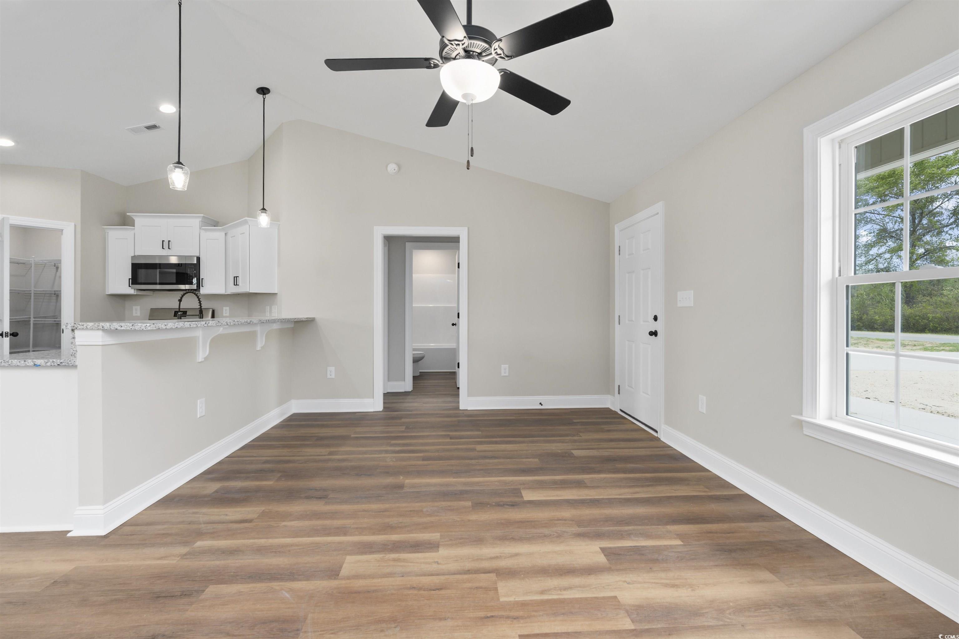 3427 B And S Road Loris, SC 29569 - Photo 33 of 33 Kitchen featuring a kitchen breakfast bar, white c