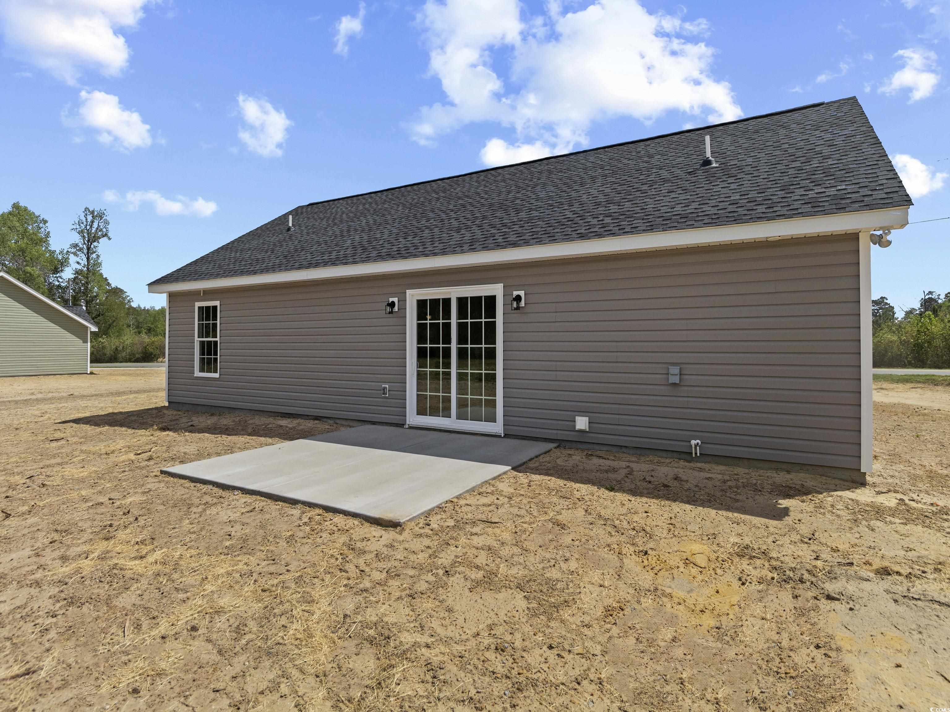 3427 B And S Road Loris, SC 29569 - Photo 5 of 33 Back of house featuring a shingled roof and a pati