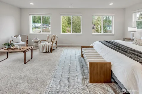 a bedroom with a bed and a couch