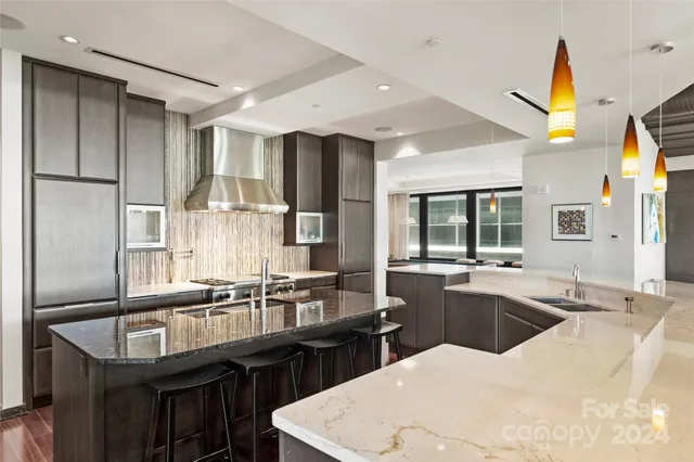 a kitchen with counter top space cabinets and stainless steel appliances