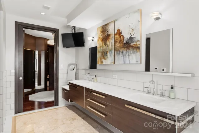 a bathroom with a sink double vanity and a mirror
