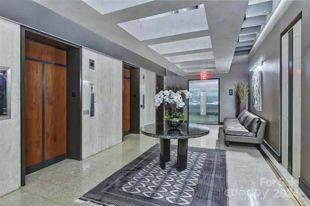 a living room filled with furniture and a table