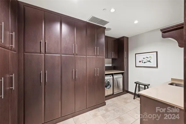 a view of a refrigerator and cabinets
