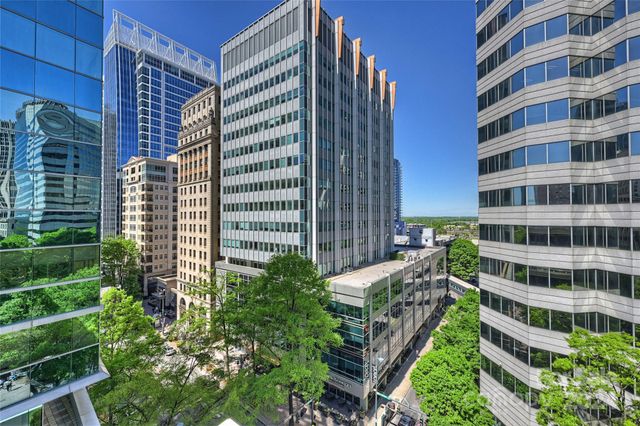 a view of a city with tall buildings