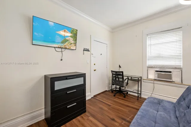 a view of a workspace with furniture and a fireplace