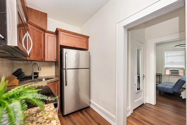 a view of a kitchen from the hallway