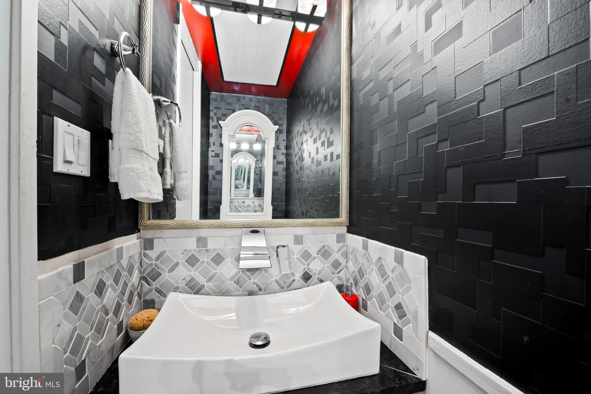 1407 Jordan Street Baltimore, MD 21217 - Photo 31 of 75 a bathroom with a sink and a mirror