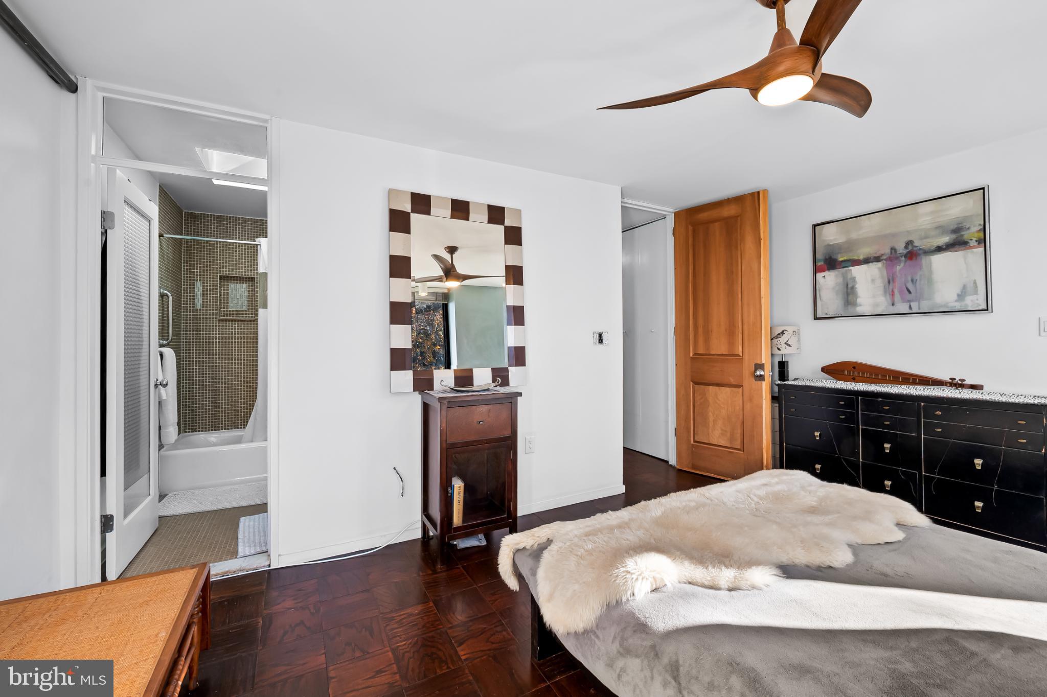 1407 Jordan Street Baltimore, MD 21217 - Photo 39 of 75 a bed room with a bed and a chandelier