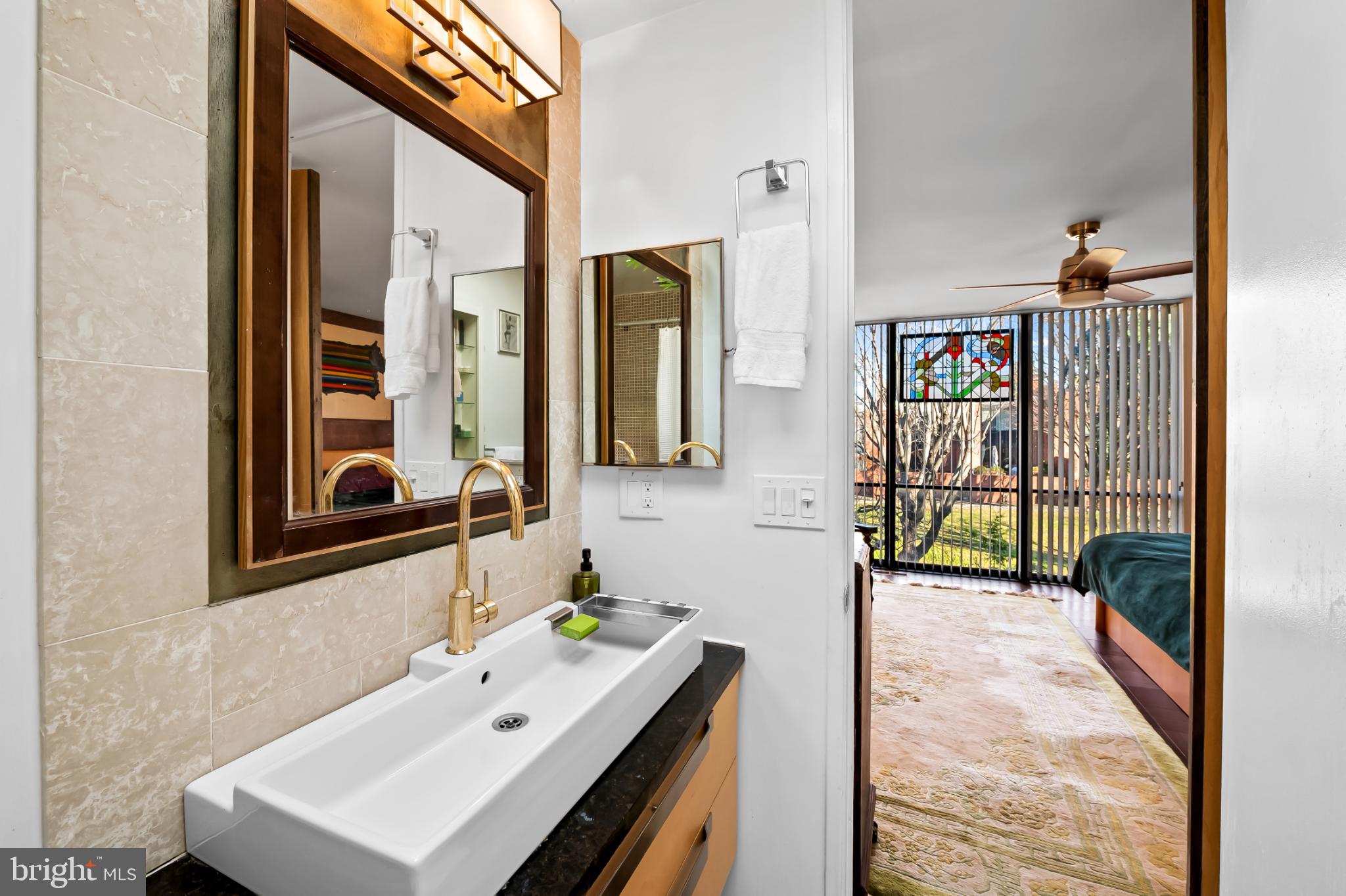 1407 Jordan Street Baltimore, MD 21217 - Photo 51 of 75 a bathroom with a sink and a mirror
