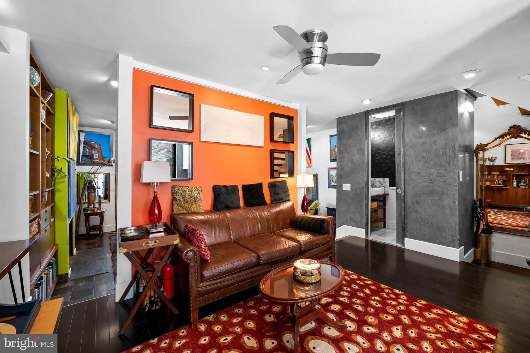 1407 Jordan Street Baltimore, MD 21217 - Photo 9 of 75 a living room with furniture a rug and a chandelier