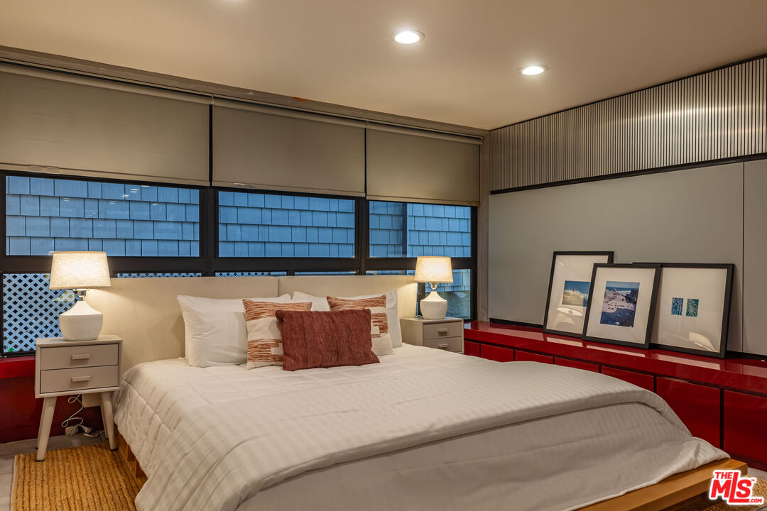 25002 Malibu Road Malibu, CA 90265 - Photo 42 of 60 a bedroom with a bed and wooden floor