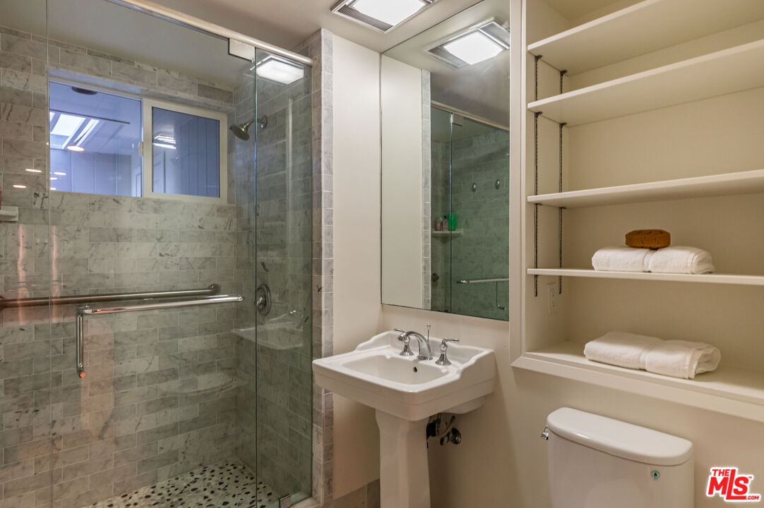 25002 Malibu Road Malibu, CA 90265 - Photo 43 of 60 a bathroom with a sink a toilet and shower