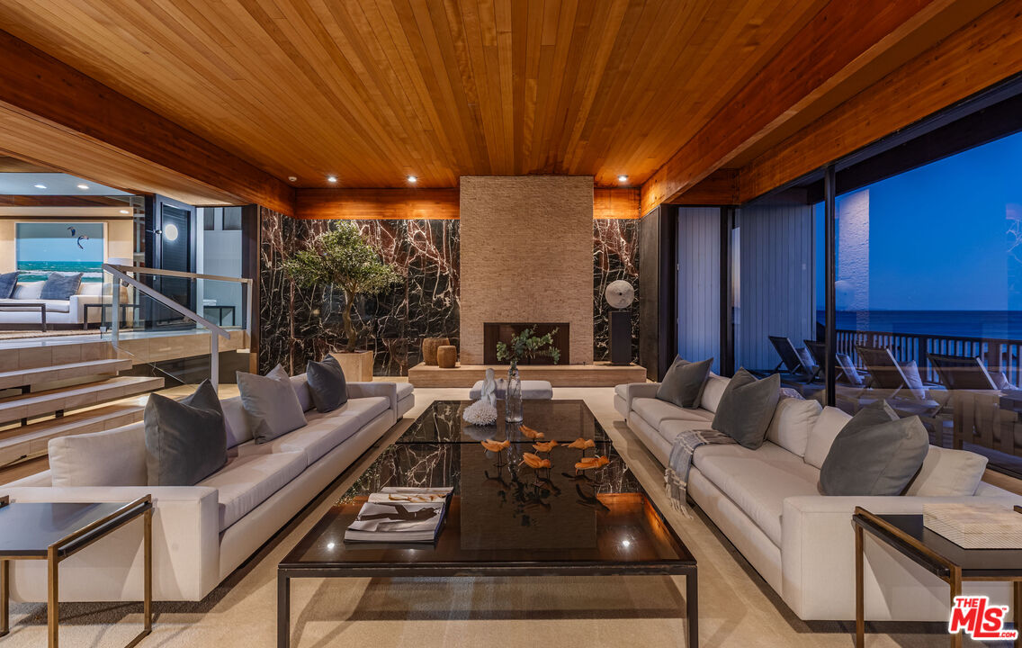 25002 Malibu Road Malibu, CA 90265 - Photo 58 of 60 a living room with furniture and a large window