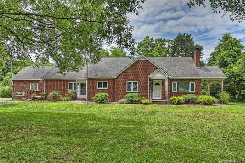 4917 Morgan Mill Road Monroe, NC 28110 - Photo 1 of 36 a front view of a house with a garden