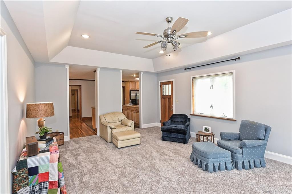 4917 Morgan Mill Road Monroe, NC 28110 - Photo 18 of 36 a living room with furniture and a flat screen tv