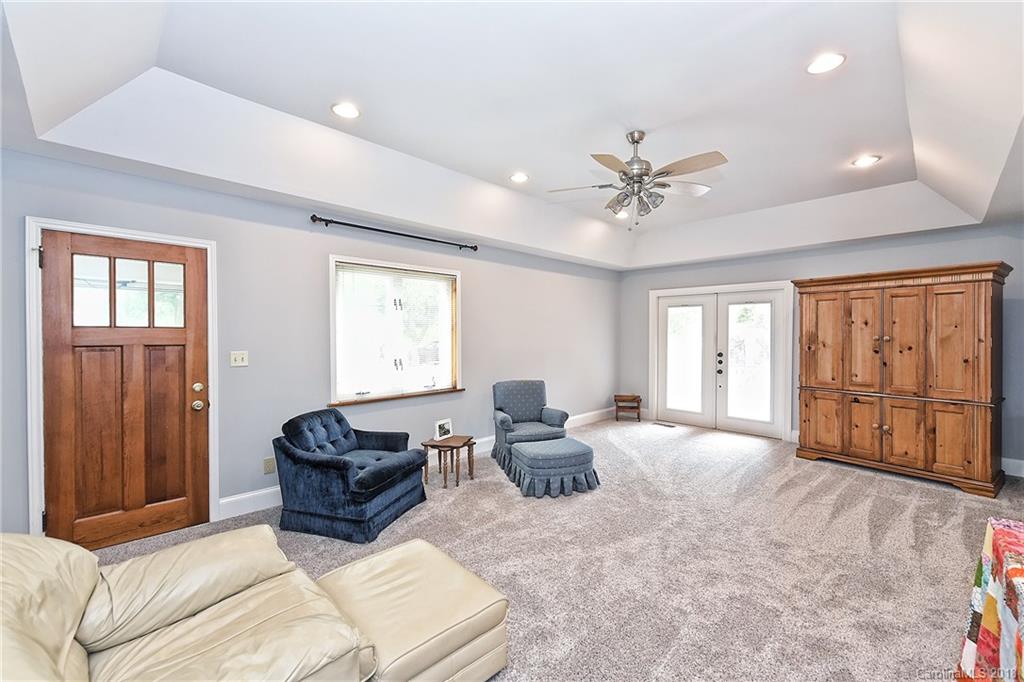 4917 Morgan Mill Road Monroe, NC 28110 - Photo 19 of 36 a living room with furniture ceiling fan and a window