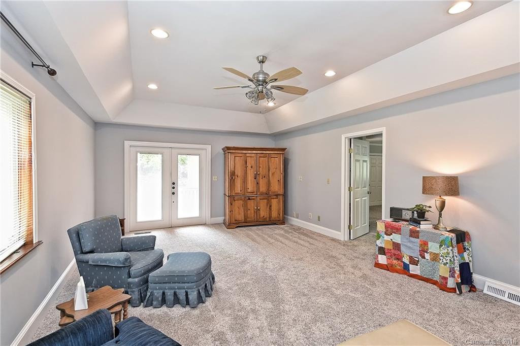 4917 Morgan Mill Road Monroe, NC 28110 - Photo 20 of 36 a bedroom with furniture and a large window