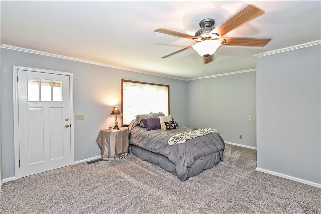 4917 Morgan Mill Road Monroe, NC 28110 - Photo 22 of 36 a bed room with a bed and a window