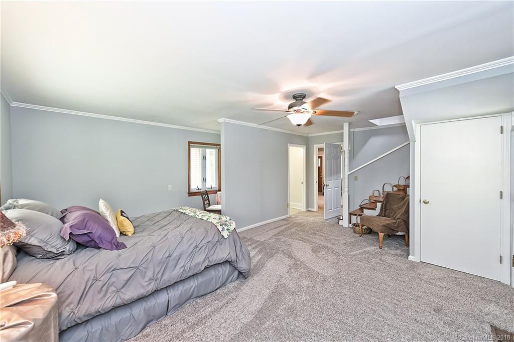 4917 Morgan Mill Road Monroe, NC 28110 - Photo 23 of 36 a bedroom with a bed and couch